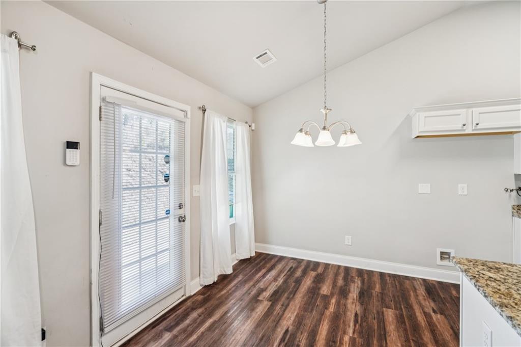 224 Katie Lane Commerce, GA 30529 - Photo 13 of 35 a view of empty room with wooden floor and fan