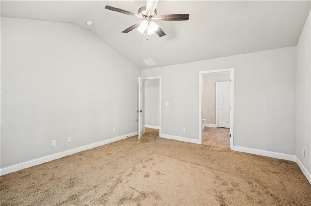224 Katie Lane Commerce, GA 30529 - Photo 20 of 35 an empty room with chandelier fan