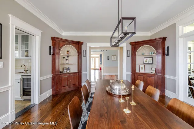a view of a livingroom with furniture window and wooden floor