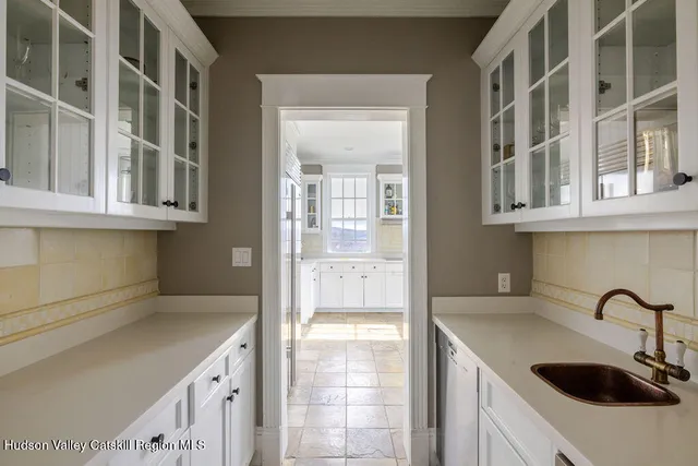 a kitchen with stainless steel appliances granite countertop a sink and cabinets