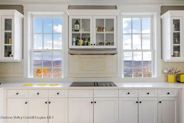 a kitchen with granite countertop a sink and a window