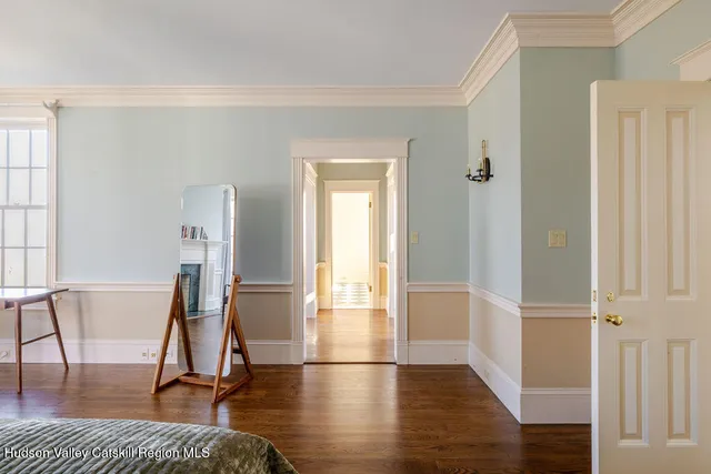 a view of a room with wooden floor and windows
