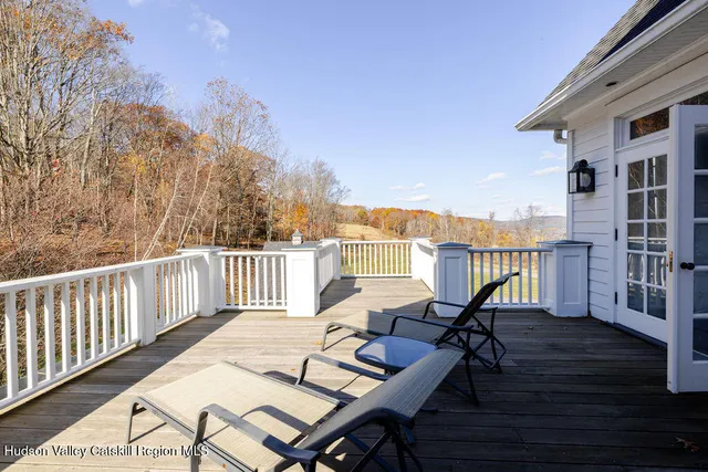 a view of a patio with wooden floor