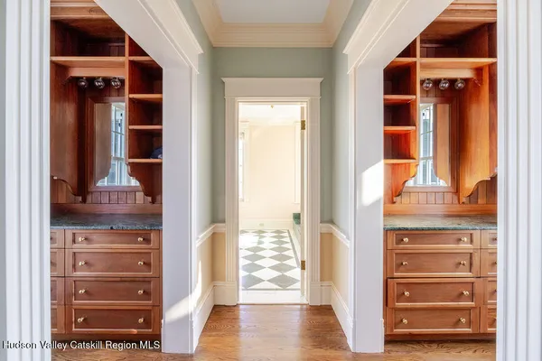 a view of walk in closet with empty racks