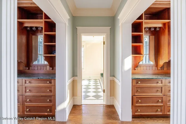a view of walk in closet with empty racks