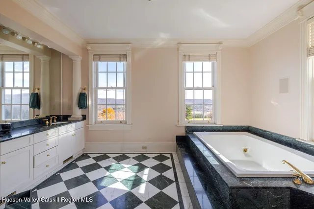 a bathroom with a bathtub and a sink
