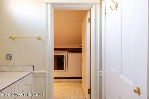 a bathroom with a shower and a sink