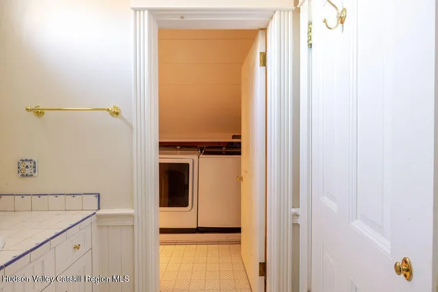 a bathroom with a shower and a sink
