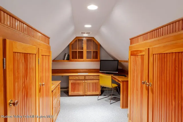 a kitchen with a table and a refrigerator