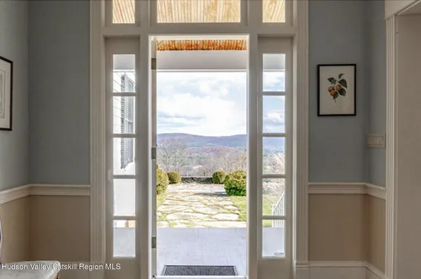 a view of a glass door and a window