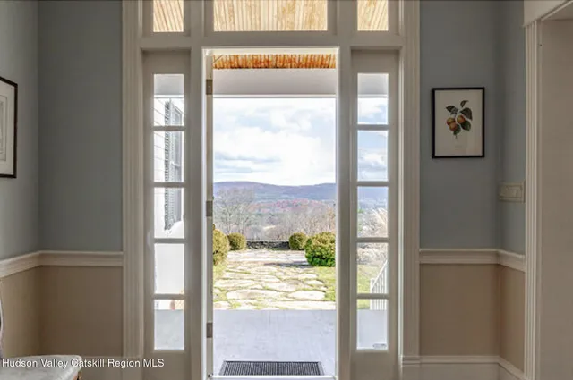 a view of a glass door and a window