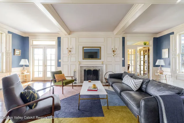 a living room with furniture or couch and a fireplace