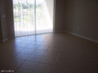 14801 Reflection Key Circle Fort Myers, FL 33907 - Photo 5 of 10 a view of an empty room with a window