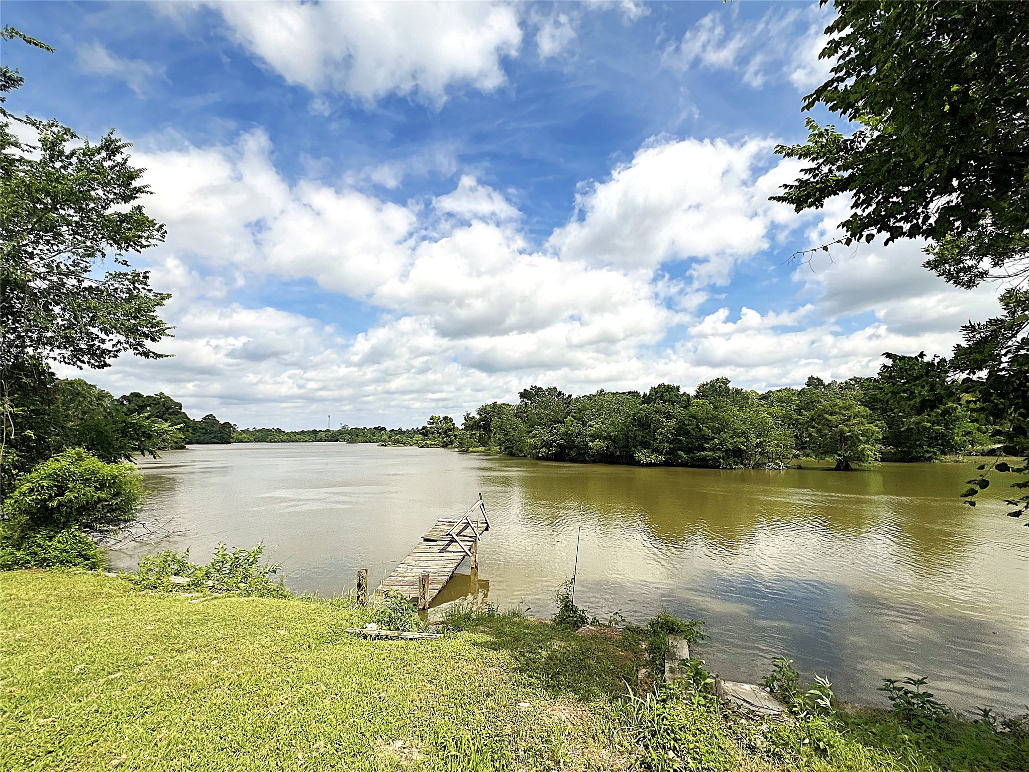 2503 River Crest, Unit 1 Houston, TX 77338 - Photo 25 of 28 a view of a lake with a yard