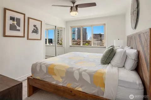 a bedroom with a bed and window