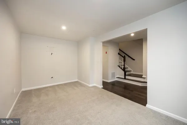 an empty room with staircase