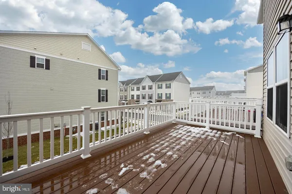 a view of a balcony with wooden floor