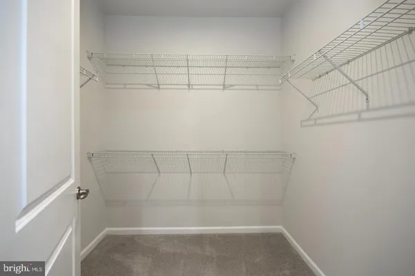 a view of a room with racks on the wall