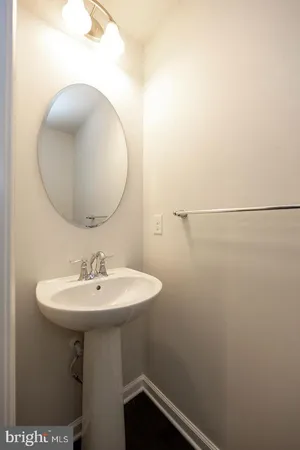 a bathroom with a sink a mirror and vanity