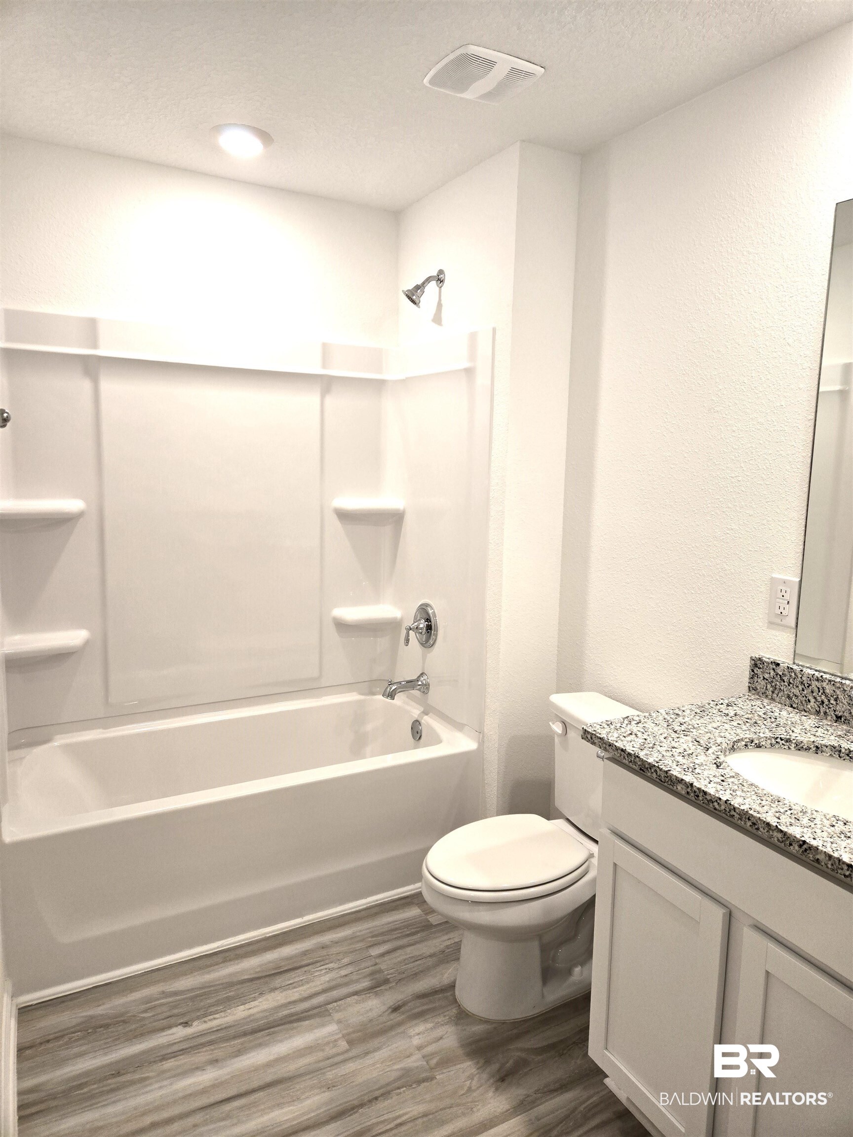 24385 Ringneck Loop Elberta, AL 36530 - Photo 21 of 33 Full bathroom featuring hardwood / wood-style floors, shower / bath combination, toilet, and vanity