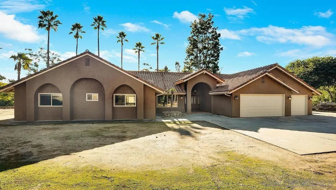 14525 Millards Ranch Lane Poway, CA 92064 - Photo 2 of 29 a front view of a house with a yard and garage