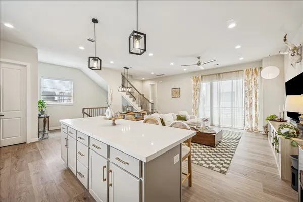 a view of a kitchen and wooden floor
