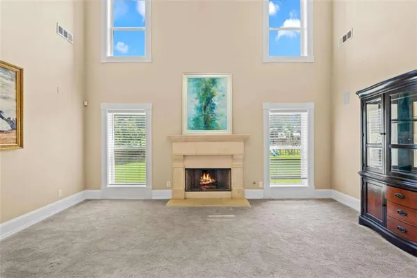 a large kitchen with stainless steel appliances granite countertop a stove and a sink