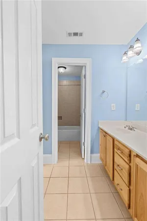 a view of an empty room with a ceiling fan