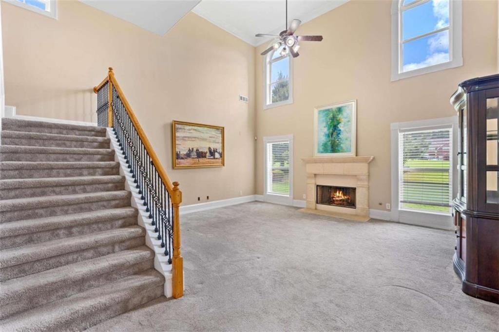 4201 Donington Way Hampton, GA 30228 - Photo 3 of 43 a view of a livingroom with an empty space and a fireplace