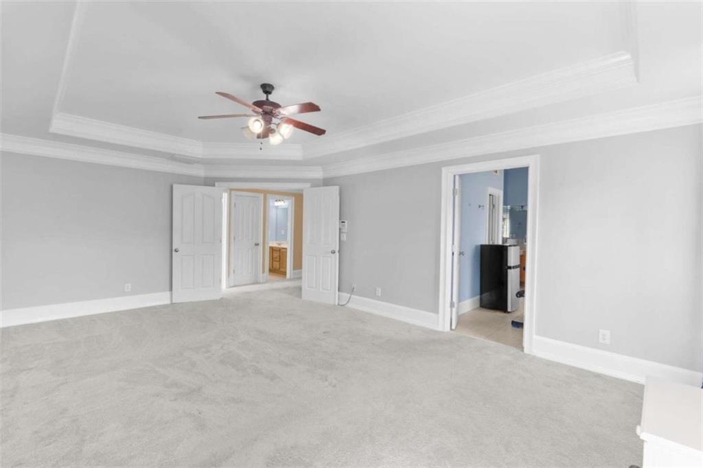 4201 Donington Way Hampton, GA 30228 - Photo 32 of 43 a view of an empty room with a ceiling fan