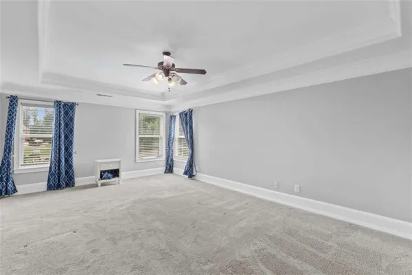a spacious bathroom with a granite countertop double vanity sink and a mirror