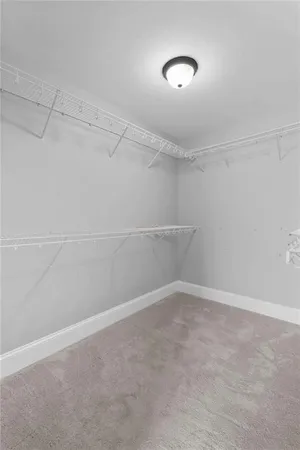 an aerial view of a house with a yard and trees