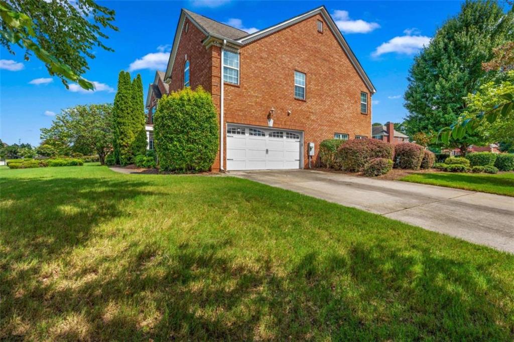 4201 Donington Way Hampton, GA 30228 - Photo 38 of 43 a view of a house with a yard and plants