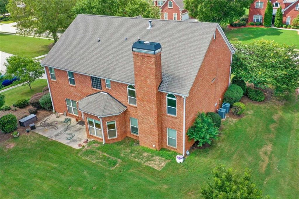 4201 Donington Way Hampton, GA 30228 - Photo 39 of 43 an aerial view of a house with a yard and trees