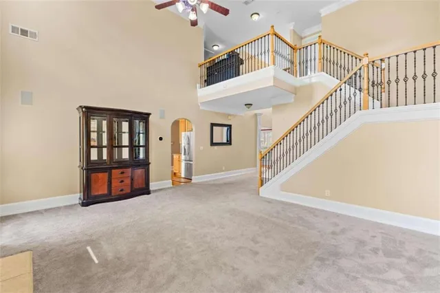 an empty room with furniture and a fireplace