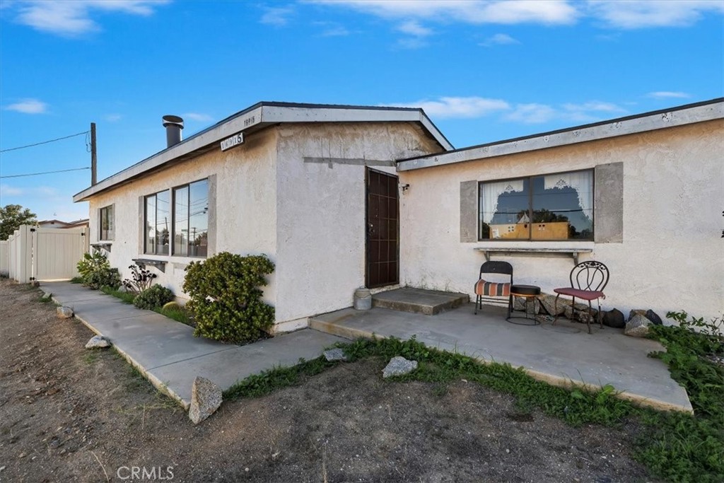 16915 Wood Road Riverside, CA 92508 - Photo 12 of 43 a view of a backyard with plants and outdoor seating