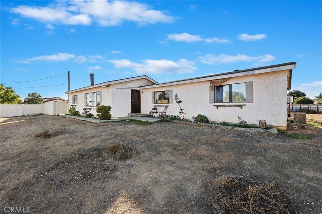 16915 Wood Road Riverside, CA 92508 - Photo 15 of 43 a view of a white house with a yard