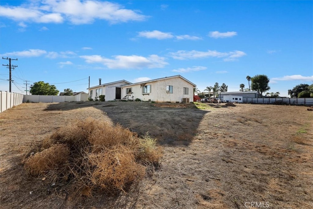 16915 Wood Road Riverside, CA 92508 - Photo 16 of 43 a view of a dirt road and building in the background