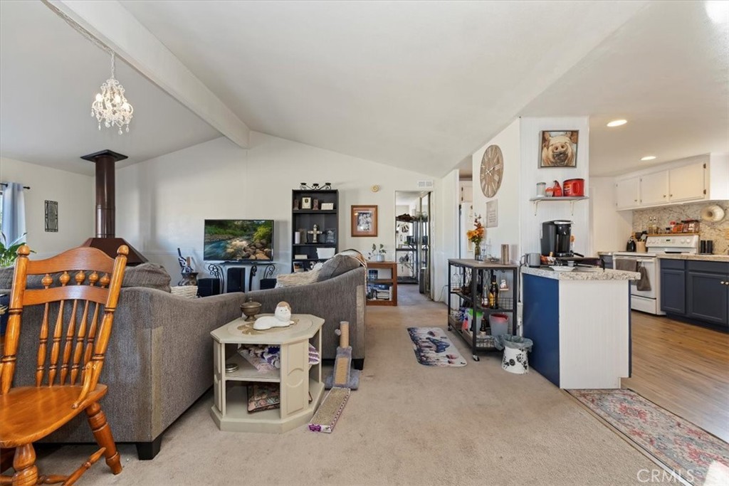 16915 Wood Road Riverside, CA 92508 - Photo 28 of 43 a living room with furniture and kitchen view