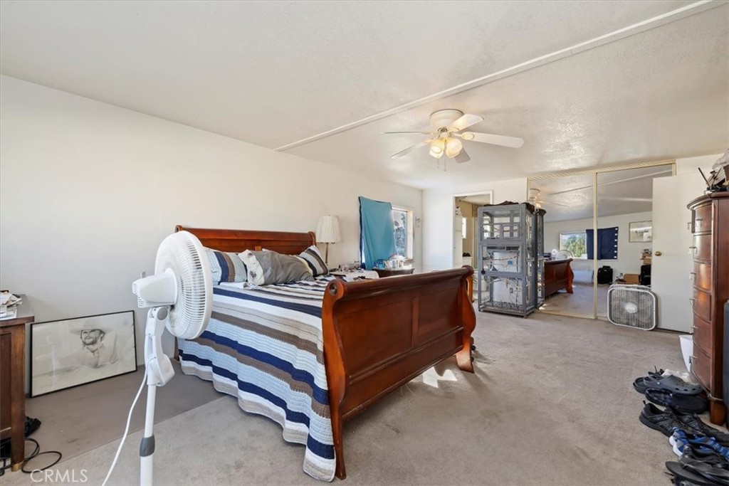 16915 Wood Road Riverside, CA 92508 - Photo 37 of 43 a bed room with a bed and a chair