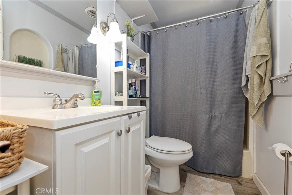 16915 Wood Road Riverside, CA 92508 - Photo 43 of 43 a bathroom with a sink a toilet and shower