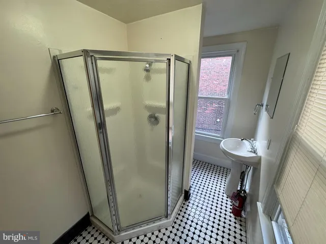 a bathroom with a shower and a toilet