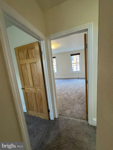 an entryway with a mirror