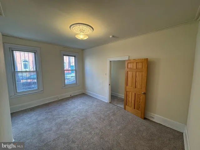 a view of empty room with windows