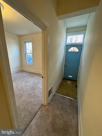 a view of an empty room and window