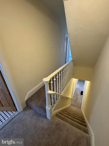 a view of a hallway with staircase