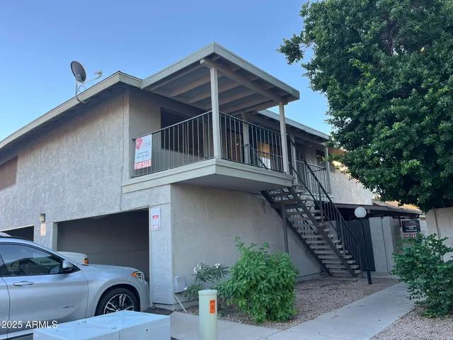 a front view of a house with garage