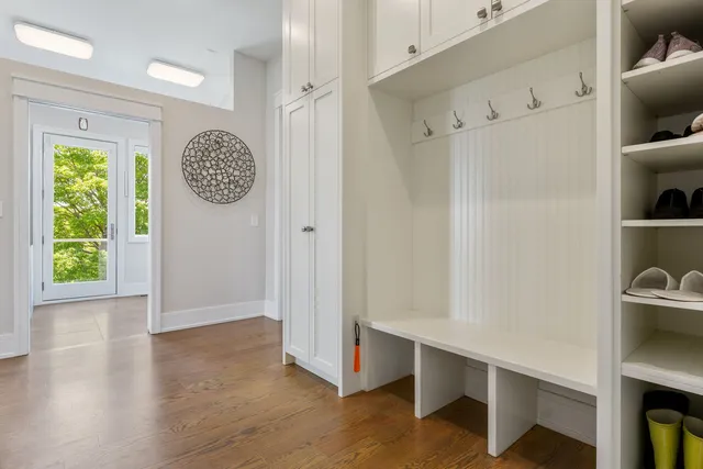 a large white kitchen with a large tub and sink