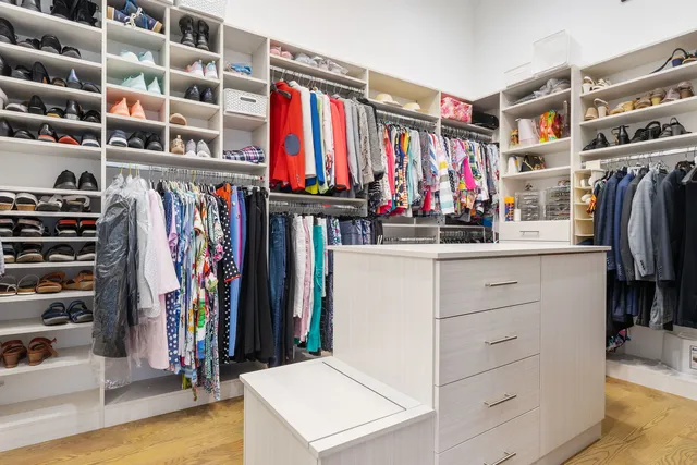 a spacious bathroom with a large tub and sink