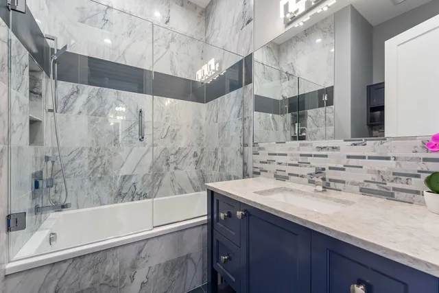 a view of a patio with table and chairs with wooden floor and fence